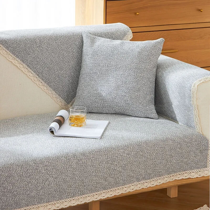 High-angle view of a full couch protected by a unisex hand-woven cotton linen cover