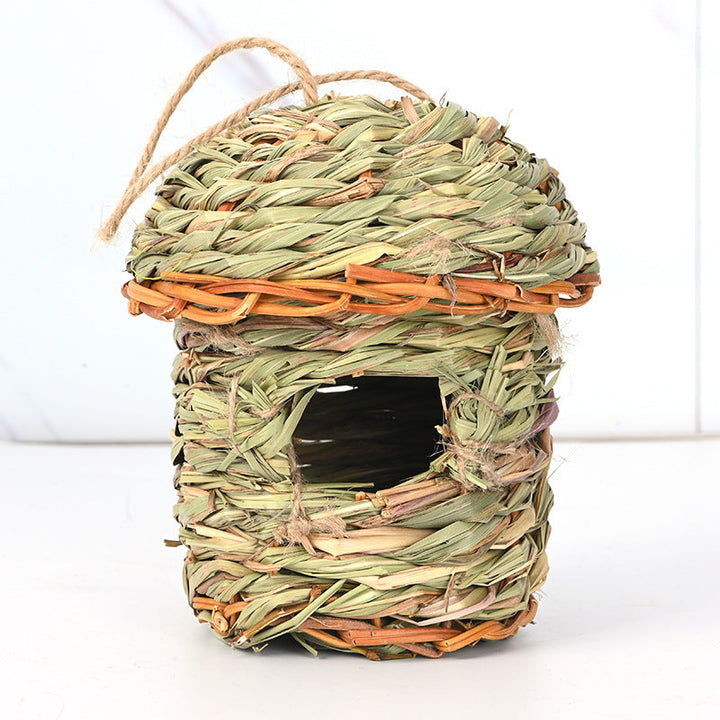 Close-up of a decorative hand-woven straw bird house, perfect for small garden birds, natural aesthetic