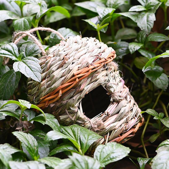 Stylish small bird house, intricately hand-woven from straw, a natural and decorative pet accessory