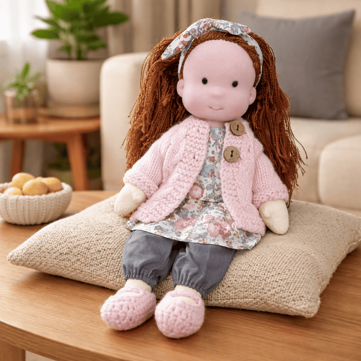 Inspires storytelling: natural cotton Waldorf doll, handmade for imaginative children.