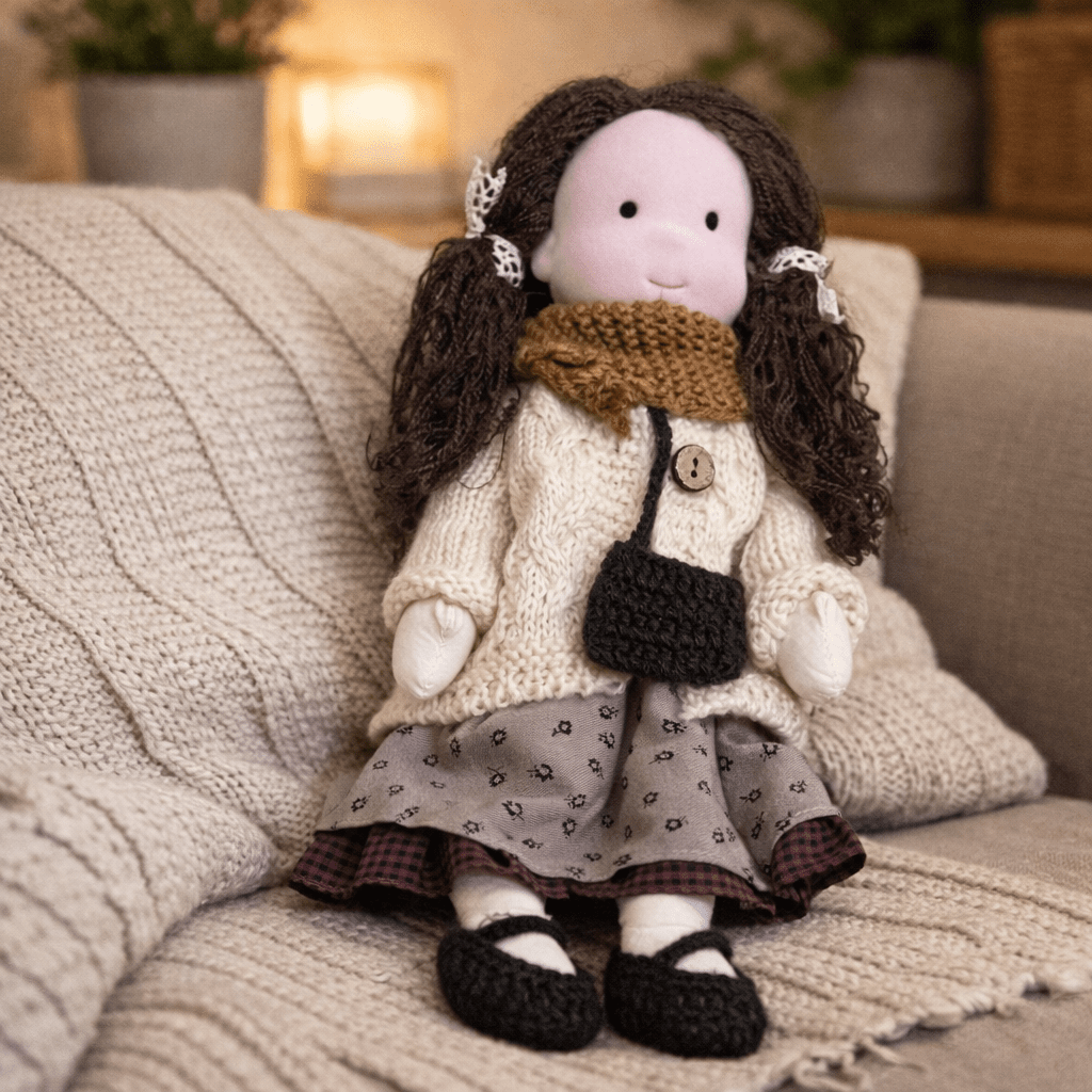 Artisanal handmade Waldorf doll, soft cotton, designed for years of creative children's play.