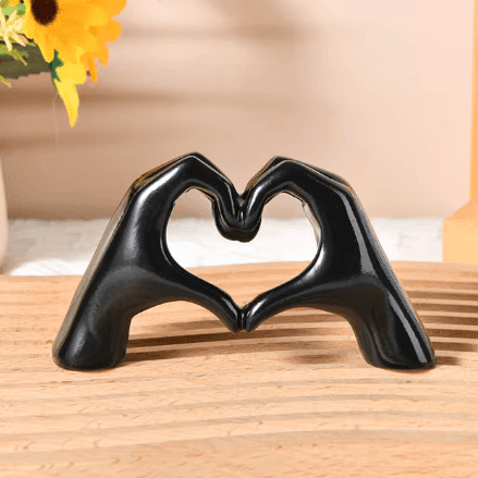 Artisan handcrafted Heart Hands Wood Sculpture, detailed wooden art perfect for rustic decor and gifts.