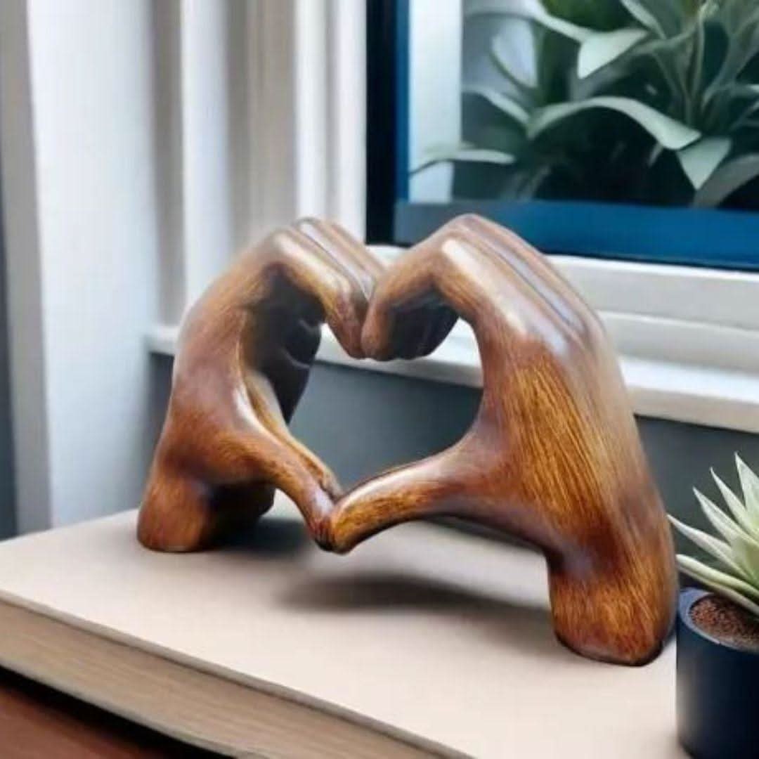 Close-up of handcrafted Heart Hands Wood Sculpture, showcasing natural wood grain, perfect for rustic decor.