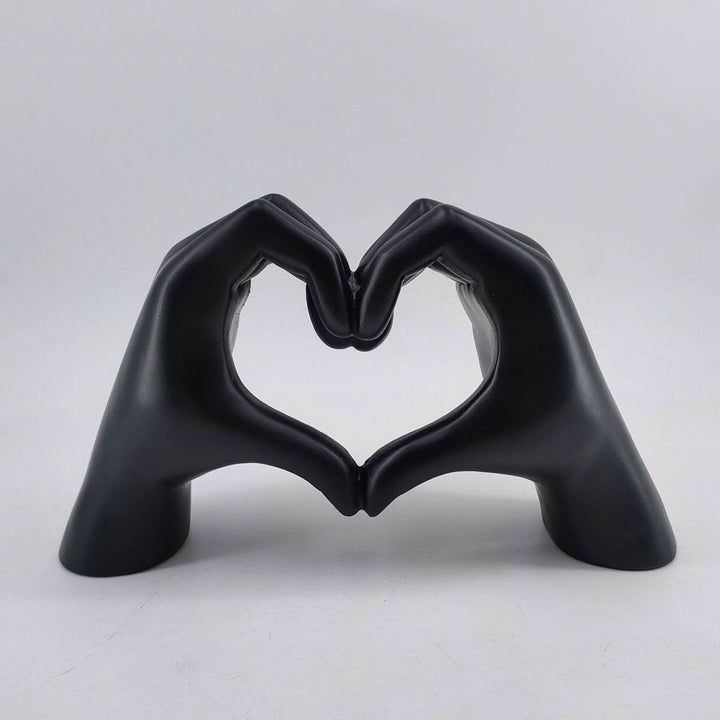 Heart Hands Wood Sculpture displayed in a cozy living room, handcrafted art enhancing rustic home decor.