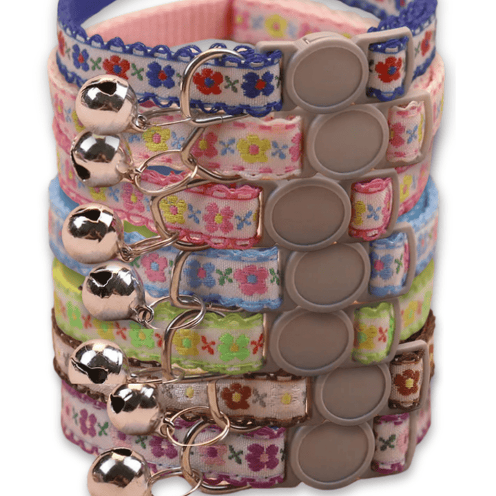 Close-up of a vibrant floral pet collar, handmade for cats and puppies, showing adjustable buckle