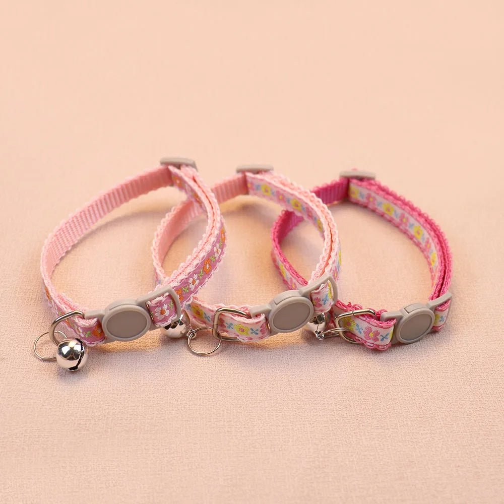 Adjustable handmade floral pet collar for small dogs and cats, showcasing durable fabric & bell.
