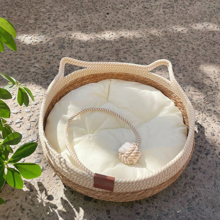 Handmade round cotton wicker pet bed for cats & small dogs, breathable design.