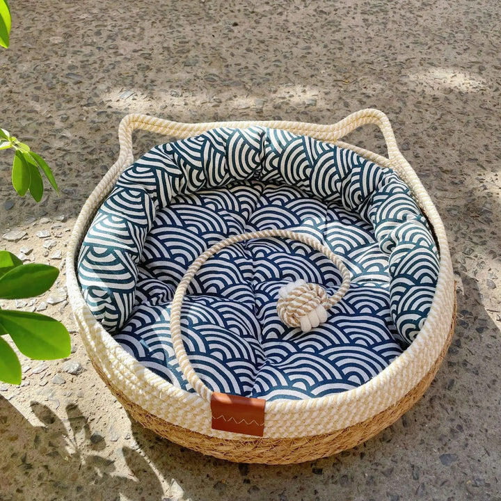 Neutral toned, breathable wicker cat bed with soft cotton cushion for pets.