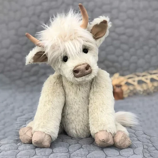 Handmade Scottish Highland Cattle plush toy with shaggy fur, perfect for cuddles & unique decor.
