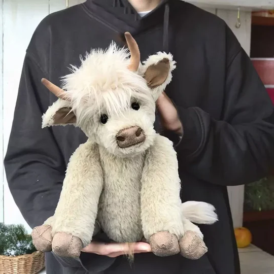 Soft alpaca blend handmade Scottish Highland Cattle plush, a unique & cuddly stuffed animal gift.