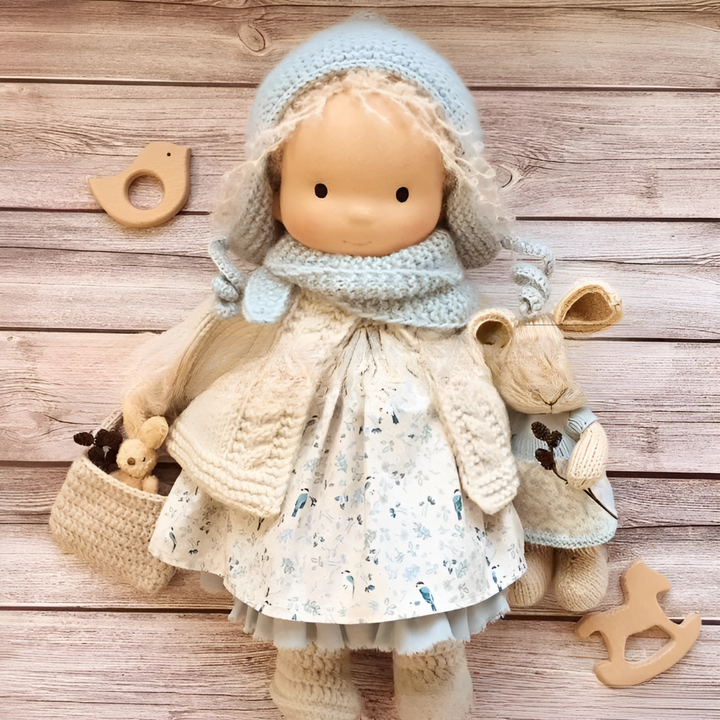 Soft cloth doll, Waldorf style, made with organic cotton for imaginative children's play.