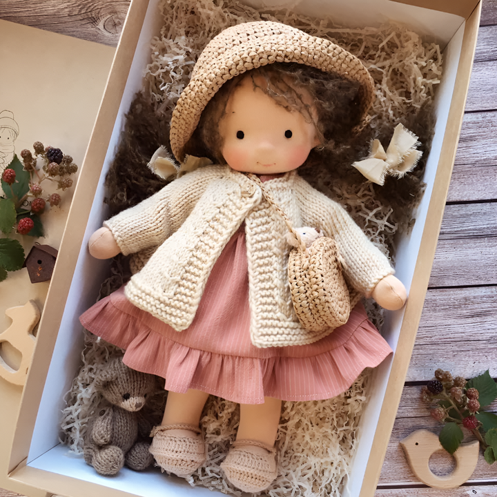 Toddler's organic cotton Waldorf doll, a soft handmade cloth toy for imaginative play.