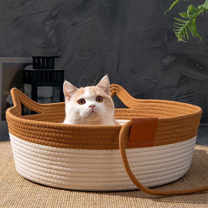 Grey handwoven cat bed with a cat sleeping inside, showing comfort & durability of pet nest
