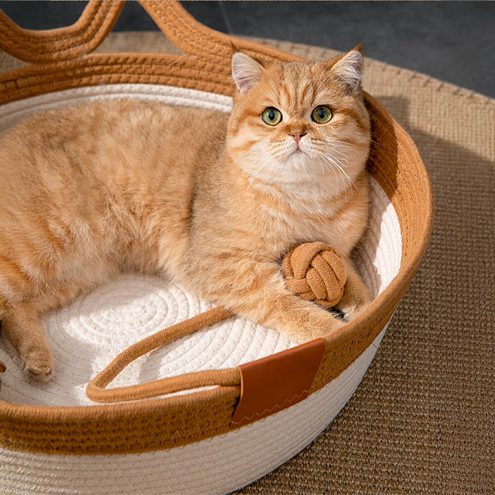 Stack of three handwoven pet beds in grey, green, & yellow, showcasing color options for cats