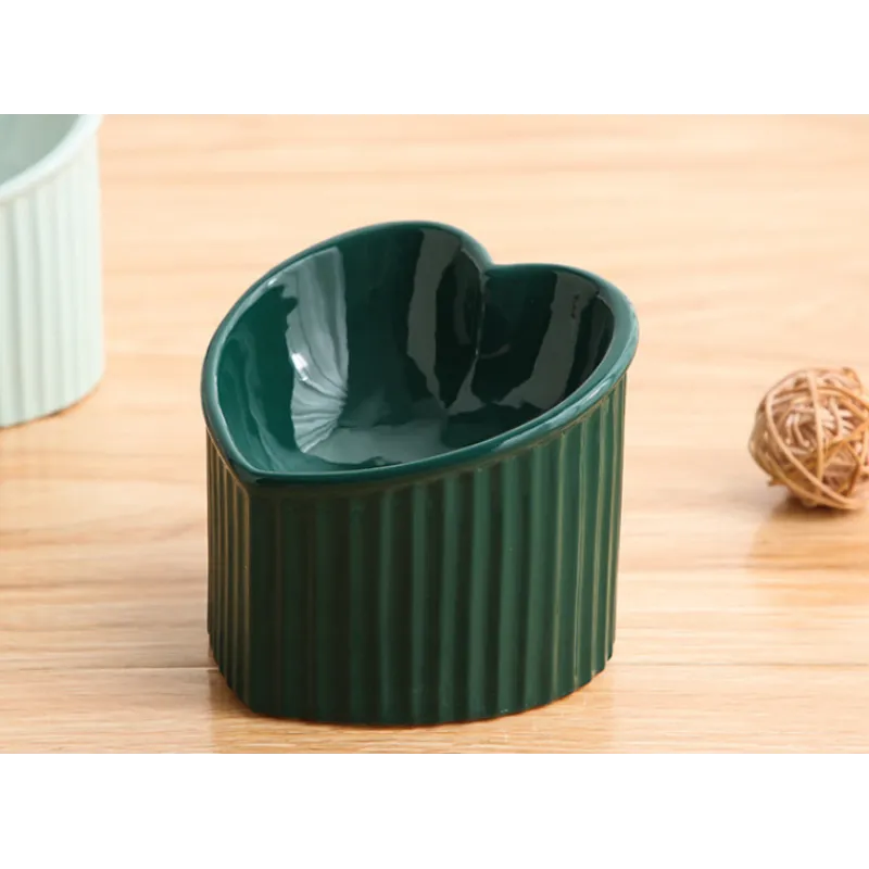 Heart-shaped ceramic pet bowl in a modern kitchen setting, hygienic and decorative pet feeder.