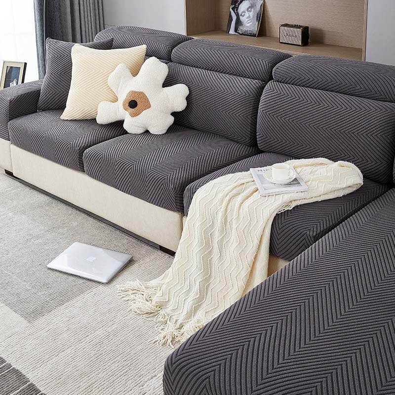 Herringbone chenille stretch sofa cover in a living room, protecting furniture from pets