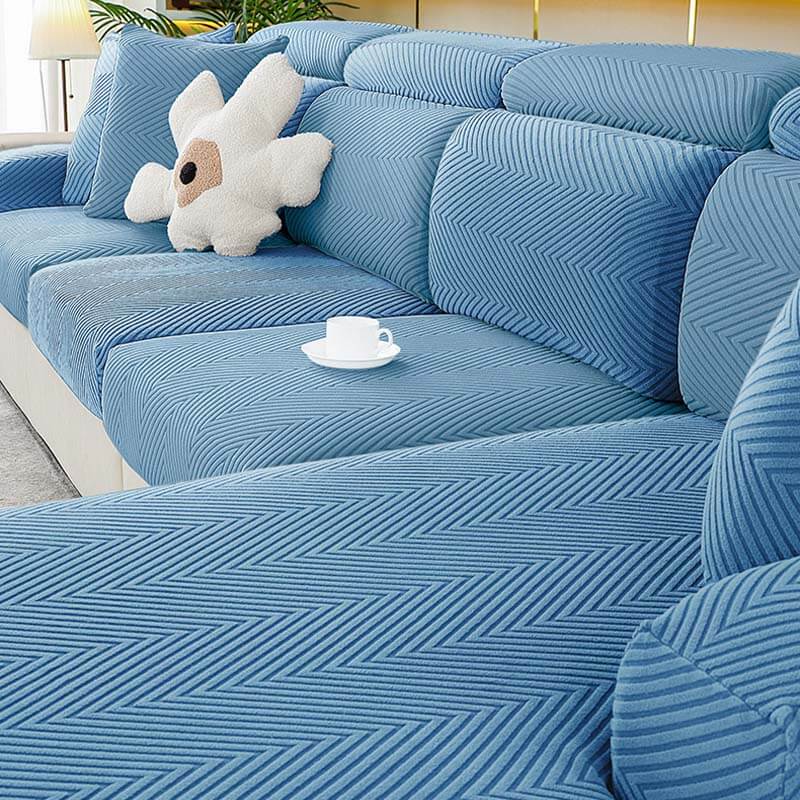 Washable herringbone chenille sofa cover snugly fitted on a three-seater couch, home decor