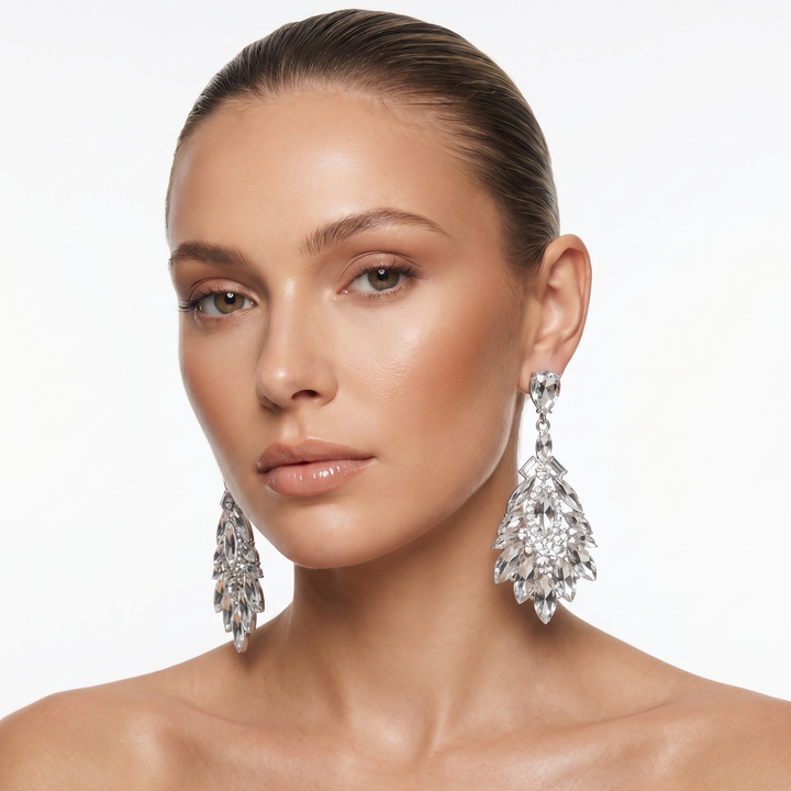 Woman wearing elegant crystal drop earrings. Stylish women's jewelry and fashion accessory, perfect for evening.
