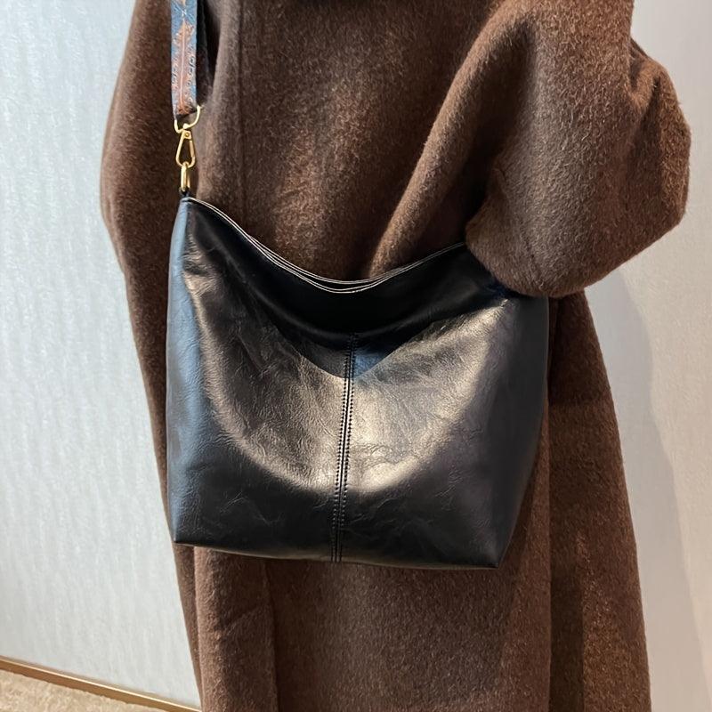 Bohemian women's shoulder bag, slouchy design, synthetic leather, distinct patterned strap.