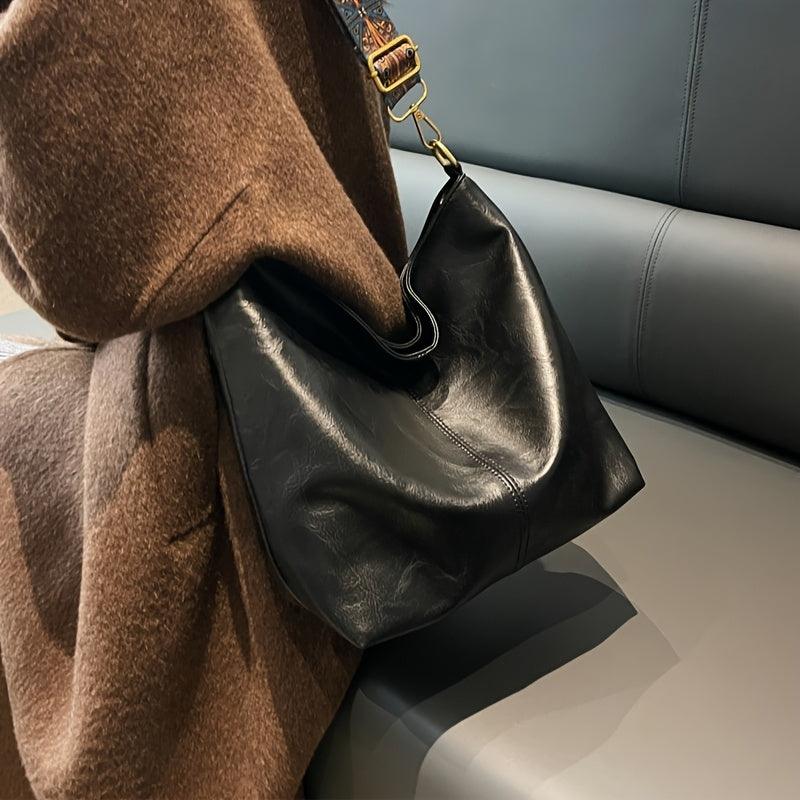 Everyday women's accessory: bohemian shoulder bag with an eye-catching patterned guitar strap.