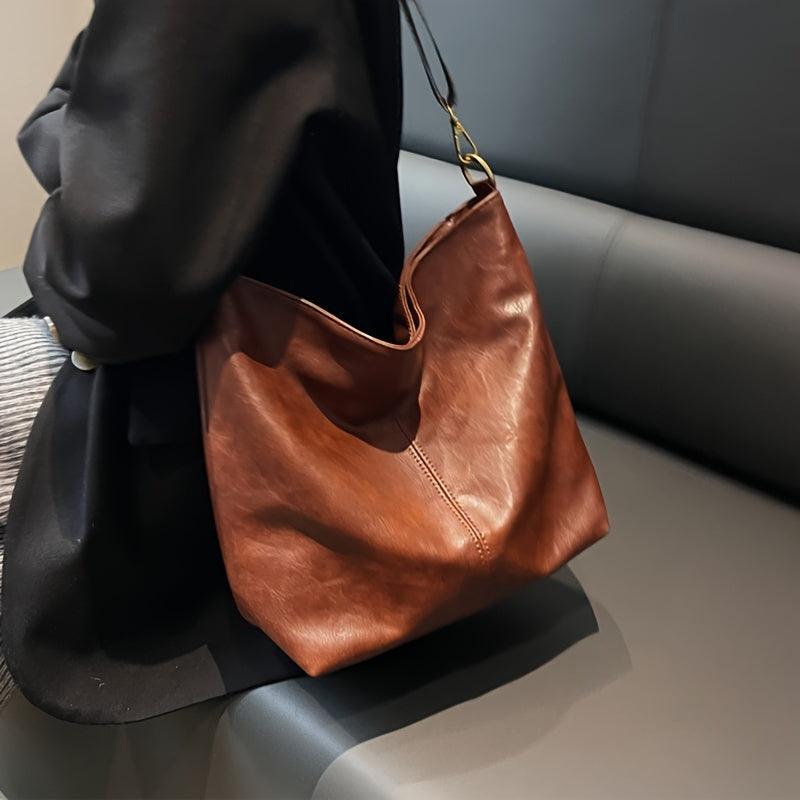 Chic women's bohemian shoulder bag featuring a stylish and unique patterned guitar strap.