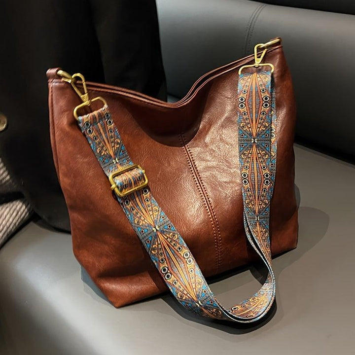 Fashionable women's bohemian bag with a unique patterned guitar strap, perfect for daily use.
