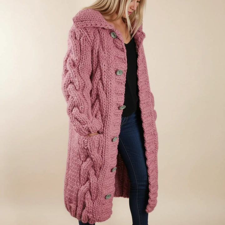 Fashionable women's cozy winter cardigan. Long hooded design, oversized fit, and button front for warmth & style.