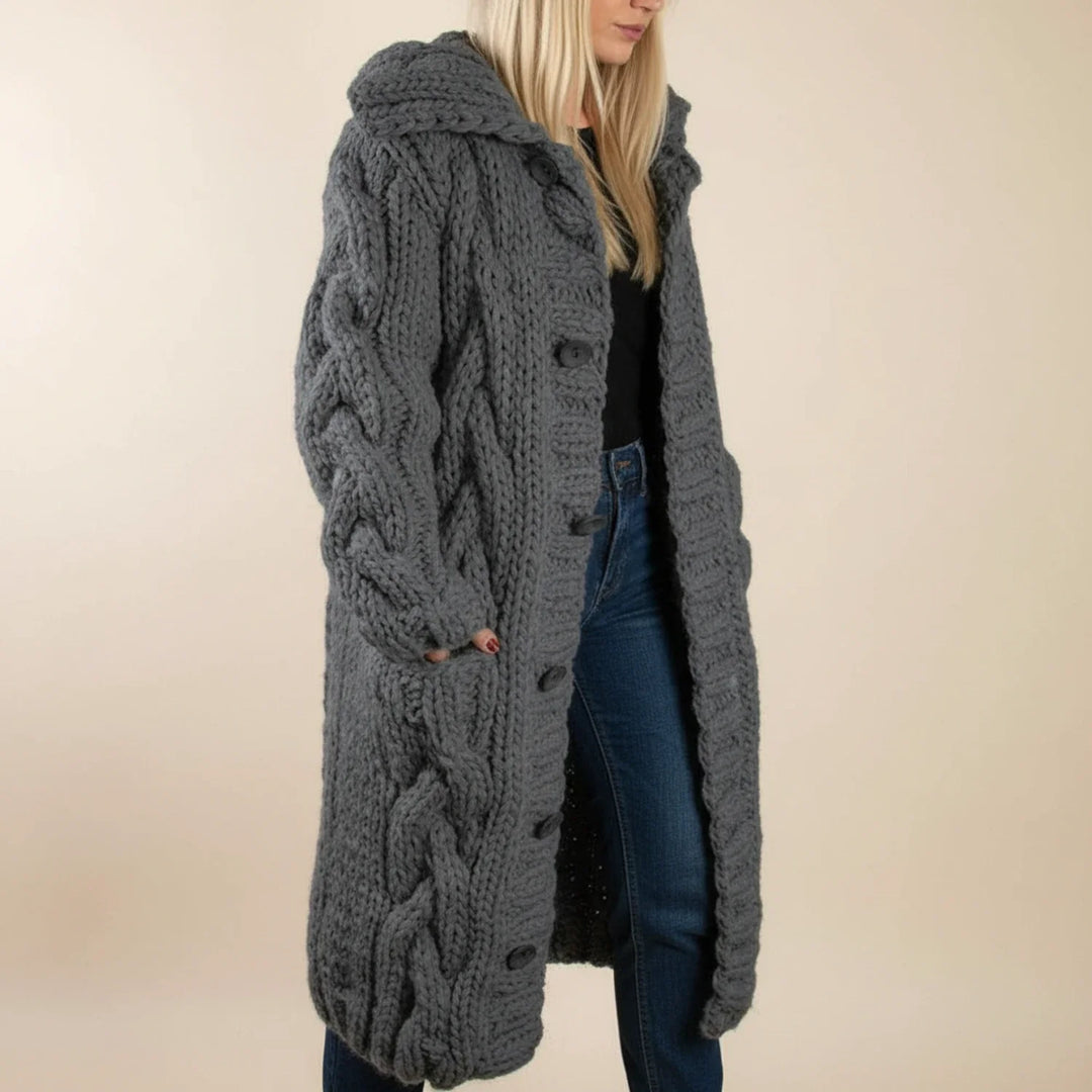 Stylish women's oversized long hooded cardigan. Features practical button front closure; ideal for winter layering.