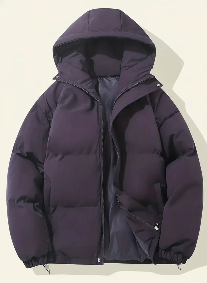 Ladies' quilted puffer jacket with cozy hood & adjustable hem, perfect for casual winter fashion.