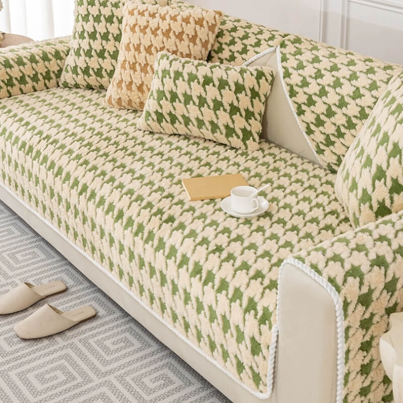 Close-up of houndstooth plush fabric anti-slip sofa protector, durable couch cover.