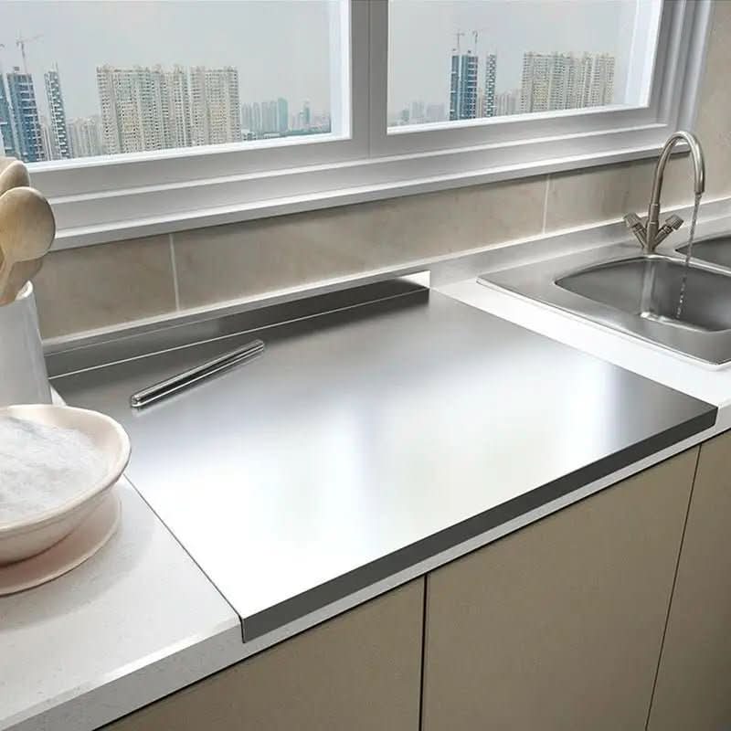 Hygienic stainless steel cutting board with non-slip grip, perfect for professional kitchen food prep.