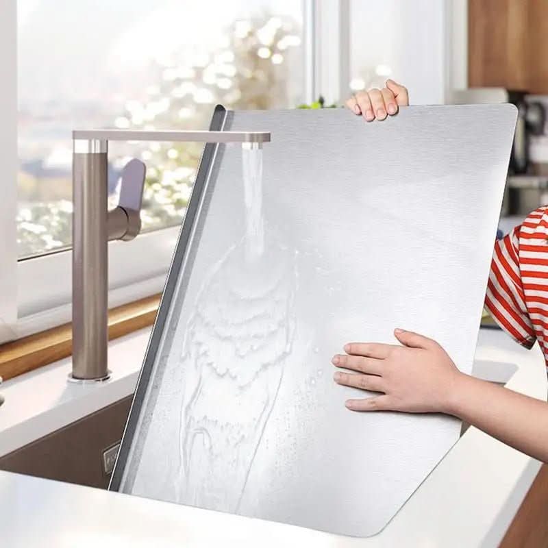 Premium stainless steel cutting board, hygienic and durable, with non-slip edges for safe food preparation.