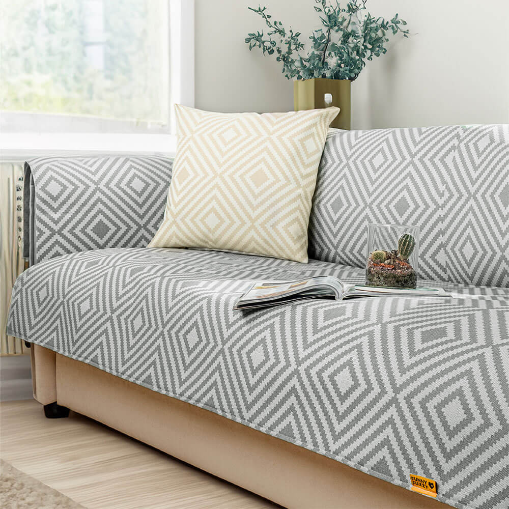Close-up of ice silk fabric on couch cover, highlighting the cooling texture and intricate geometric pattern.