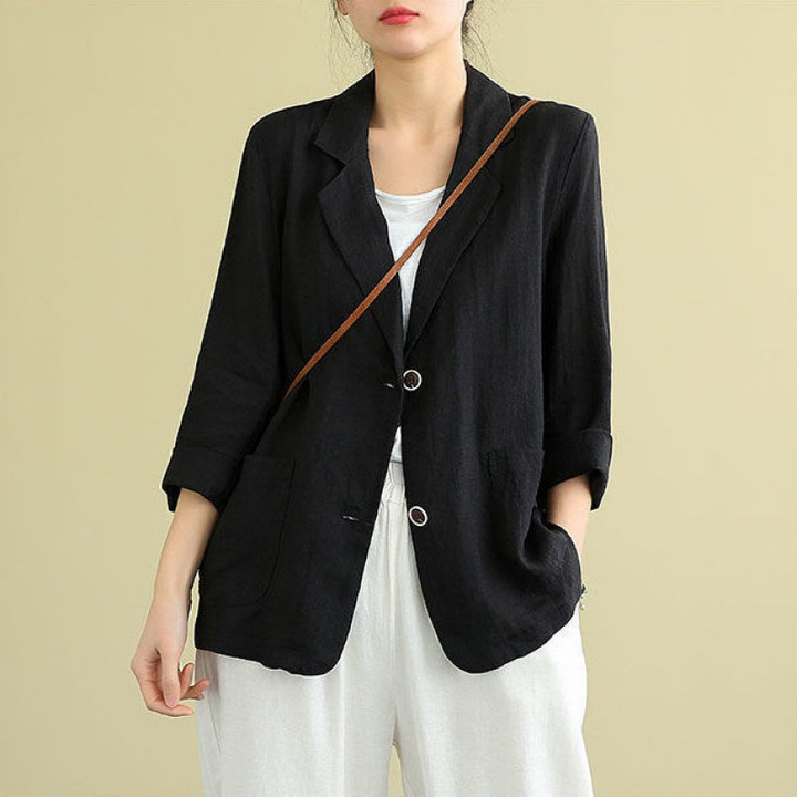 Elegant women's tailored linen blazer, ideal for professional wear or smart casual. Features pockets & modern style.