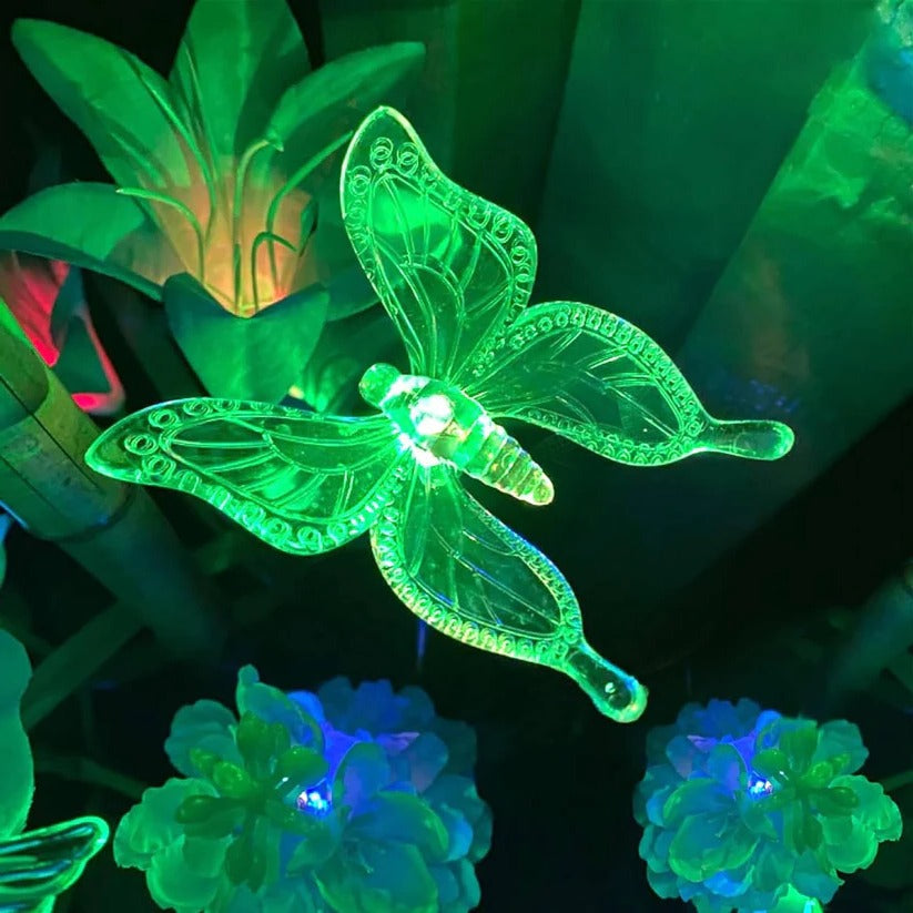 Solar-powered butterfly, hummingbird & dragonfly crystal figurine LED lights for outdoor garden & yard decor.