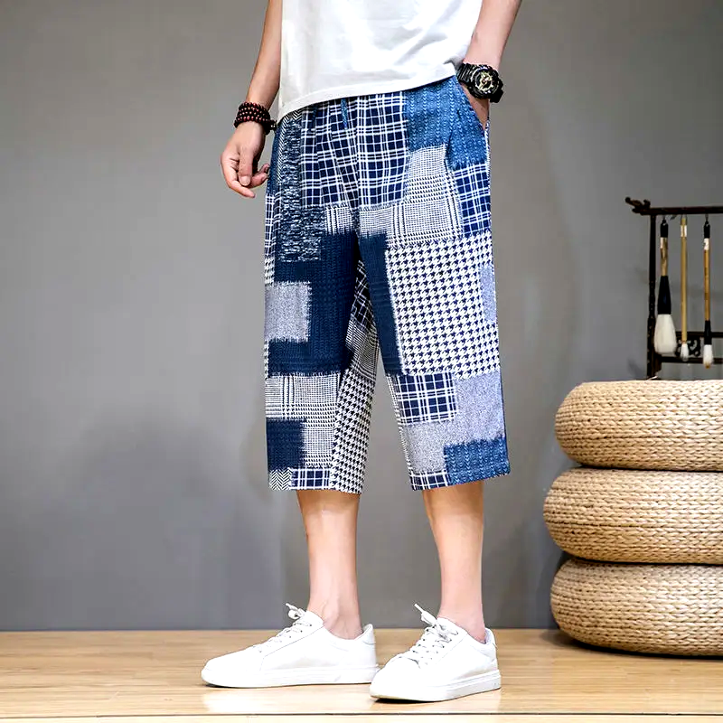 Man enjoying summer in unique patch capris shorts, perfect for active days and making a bold fashion statement.