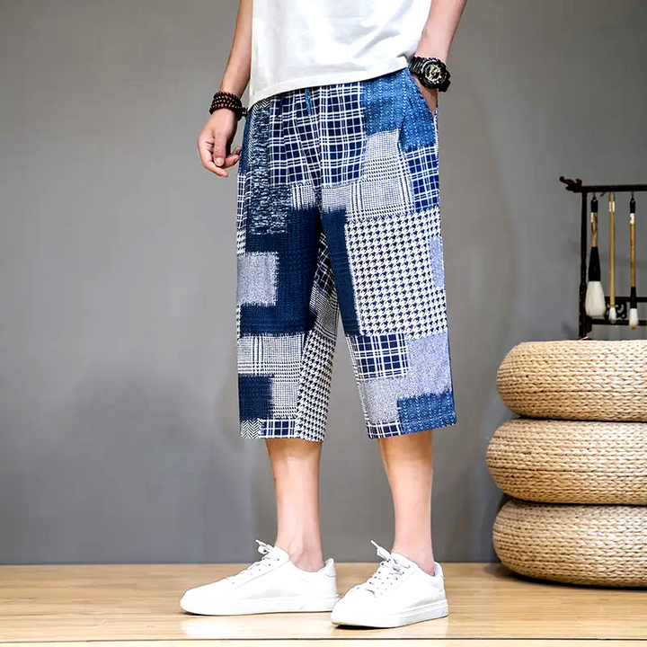 Man enjoying summer in unique patch capris shorts, perfect for active days and making a bold fashion statement.