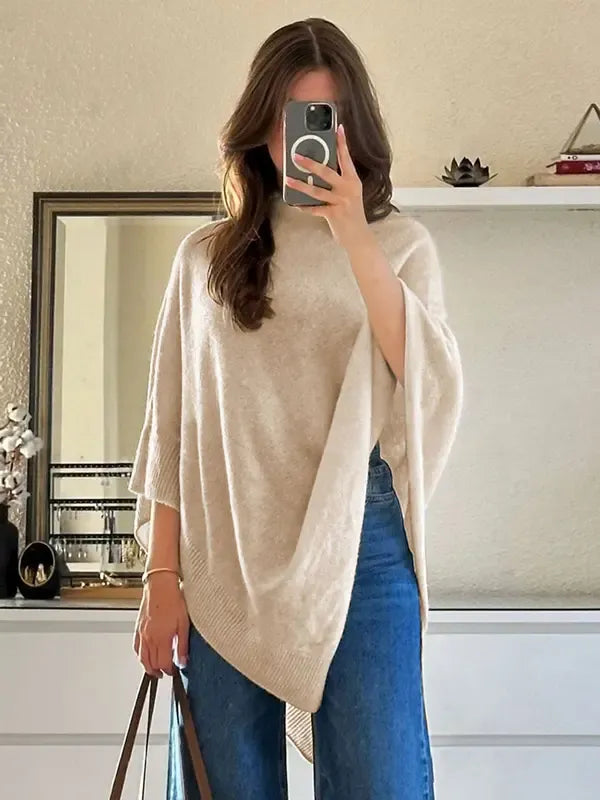 Oversized asymmetric women's knit poncho. Soft wool blend wrap, perfect for cozy fall & winter layering.