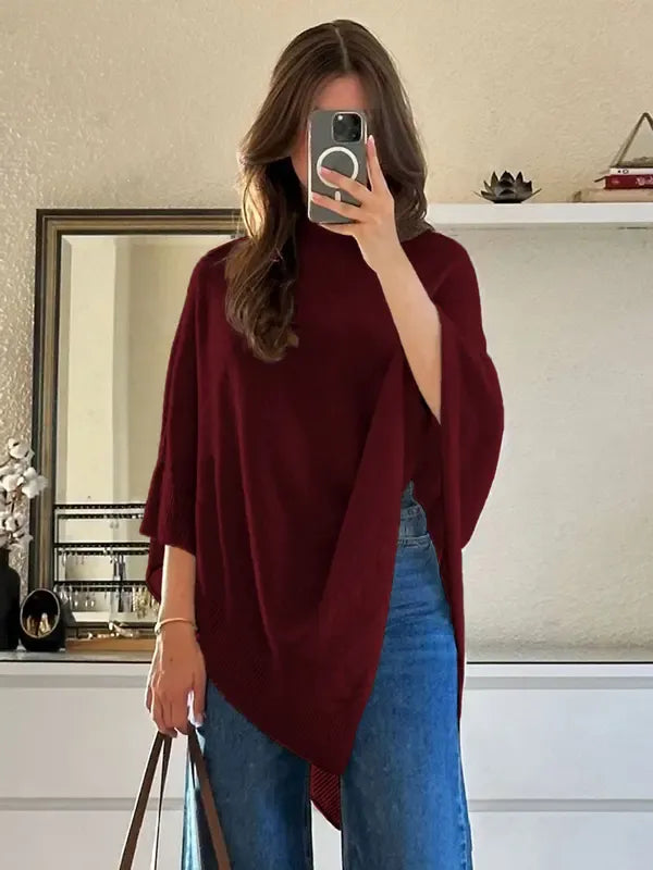 Elegant women's wool blend poncho. Soft knitwear, ideal for fall style, winter fashion, or effortless layering.