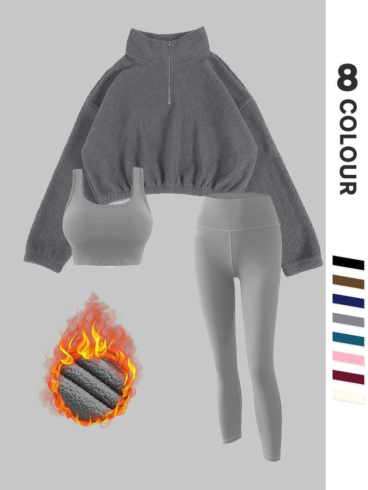 Women's thermal fleece sportswear set; sculpting leggings & warm pullover ideal for active winter sports and comfort.