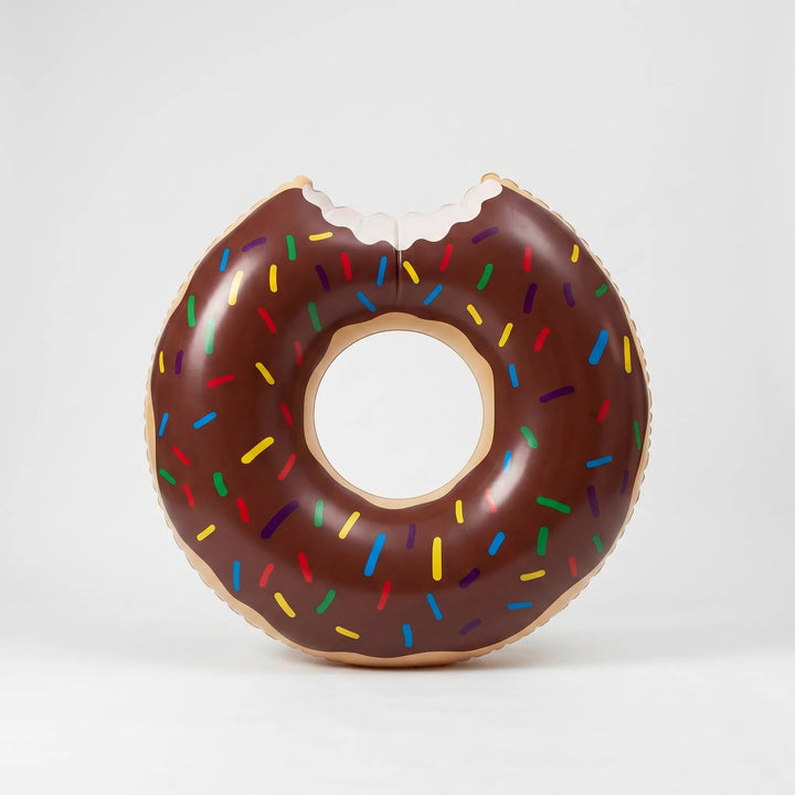 Fun novelty inflatable donut pool float, ideal summer accessory for beach, pool, and vacation enjoyment.