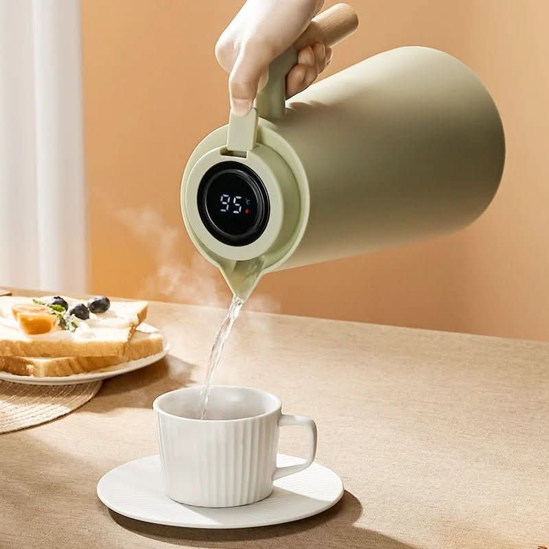 Stainless steel thermos flask with digital temp display. Perfect for hot coffee, tea, or cold water.