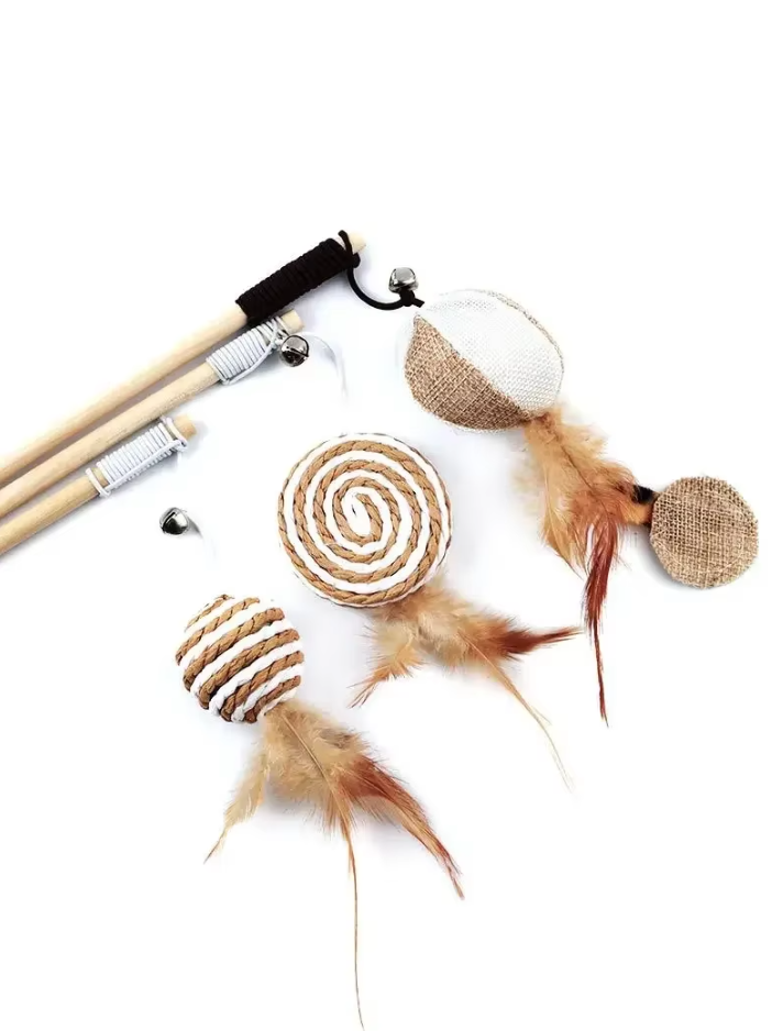 Close-up of a feather bell cat toy, highlighting its natural materials.