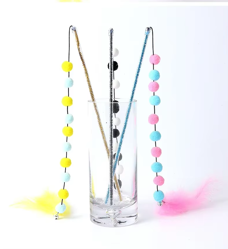 Cat toy featuring a durable rod and interchangeable feather and pom-pom ends, perfect for engaging pets