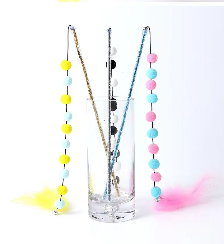 Cat toy featuring a durable rod and interchangeable feather and pom-pom ends, perfect for engaging pets