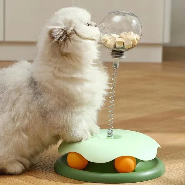 Slow feeder cat toy: a durable tumbler dispensing treats, encouraging interactive play for kittens.