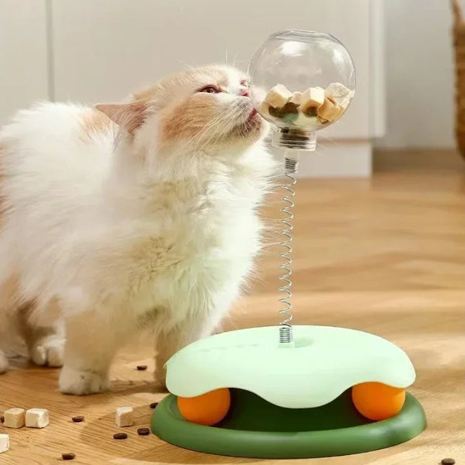 Yellow interactive cat food dispenser tumbler with transparent upper half, pet enrichment activity toy.