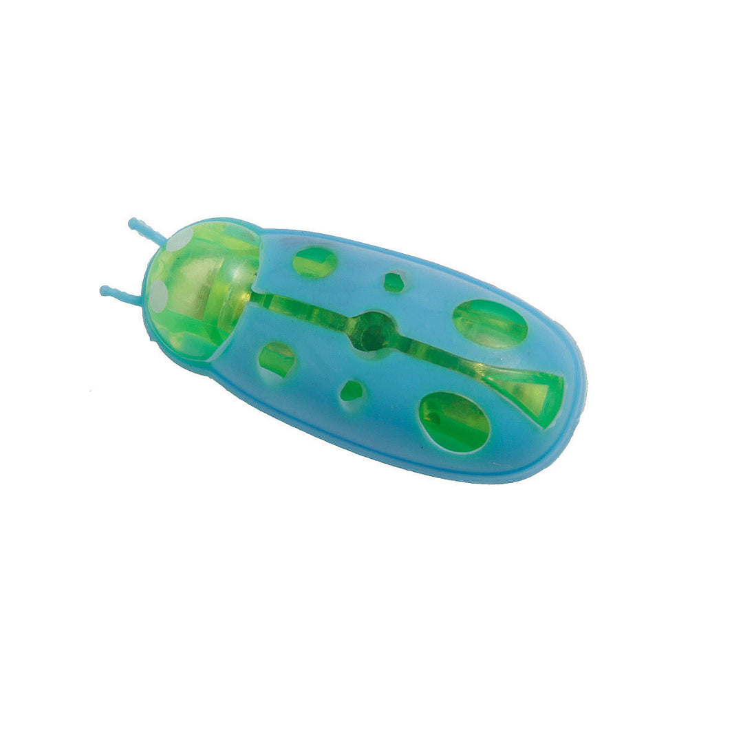 Cat actively playing with an interactive insect toy, demonstrating its effectiveness as a hunting toy.