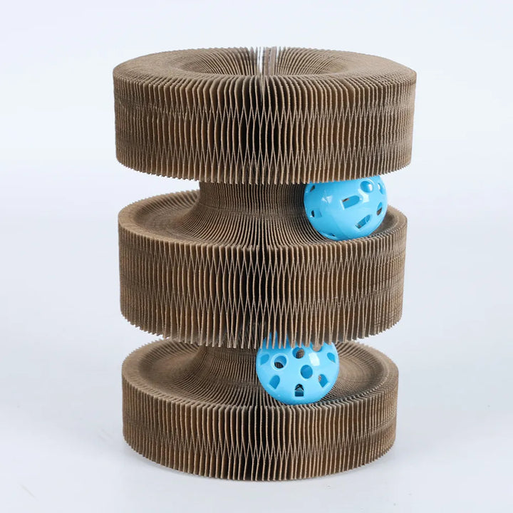 Cat batting at the interactive play ball on a beige scratching tower, for cat entertainment.