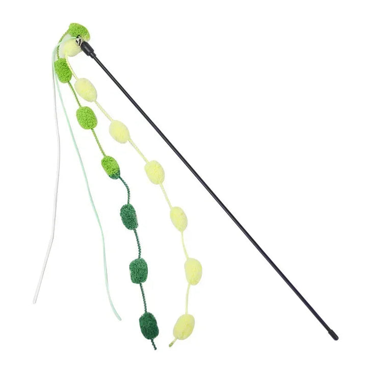 Detail of the tassel and bell attachment on an interactive cat teaser wand, promoting pet exercise and interaction